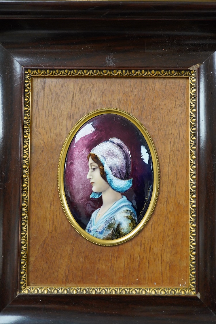 A Limoges framed oval enamel of a portrait of a lady, signed J Clement, 12cm.